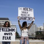 A group gathers to protest against social isolation rules of the COVID-19 pandemic, in Edmonton, Alta., on April 29, 2020.THE CANADIAN PRESS/Jason Franson