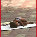 A lonely child sleeping on the pavement/TNL Archives