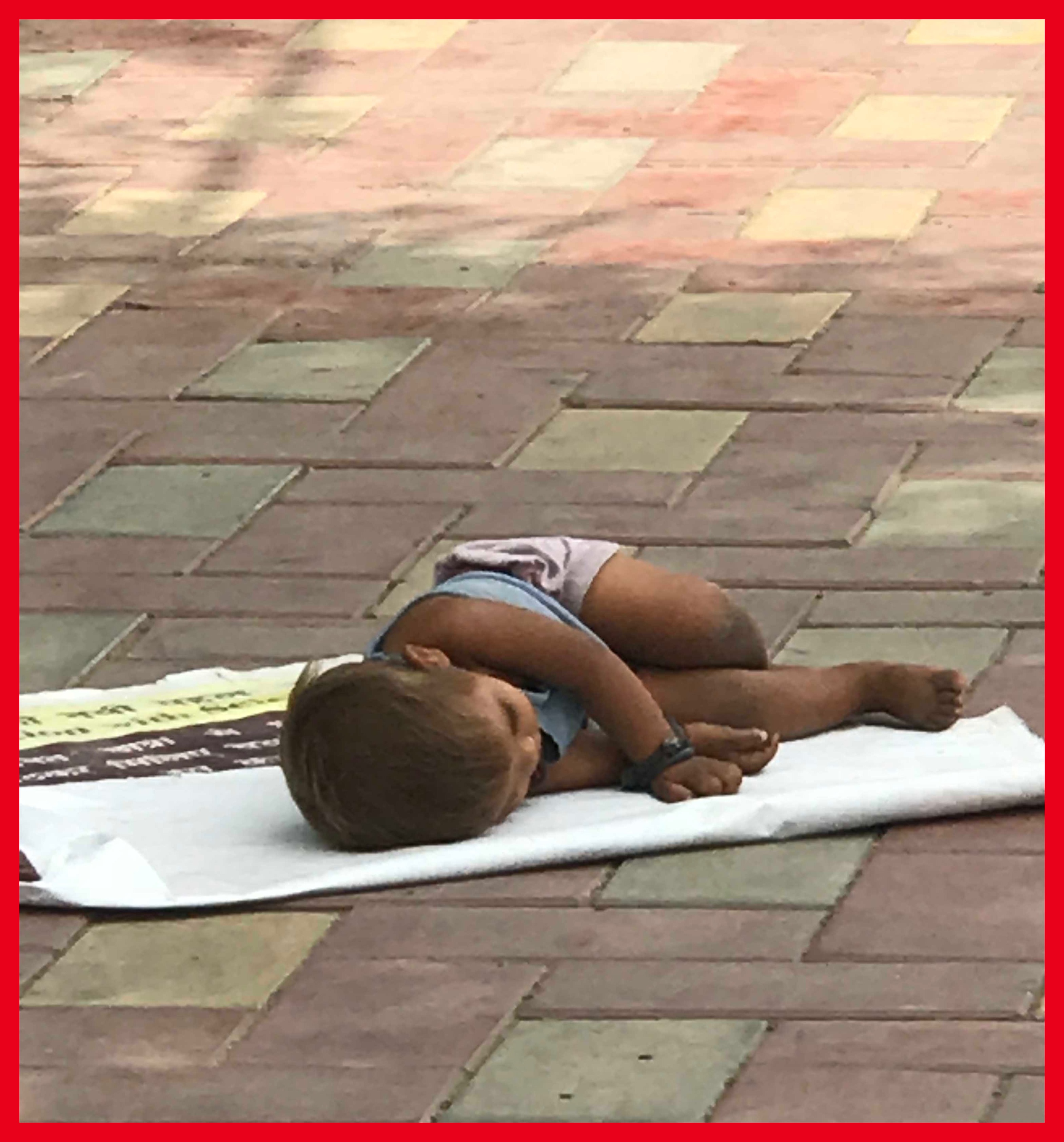 A lonely child sleeping on the pavement/TNL Archives