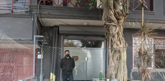 An ED official standing outside the Newsclick office in New Delhi