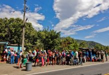 Venezuelan migrants receive food and medicine from the Red Cross near the Colombia-Venezuela border, February 2021. Schneyder Mendoza/AFP via Getty Images