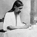 Sri Aurobindo (born Aurobindo Ghose) engrossed in writing. (Source: Wikimedia Commons)